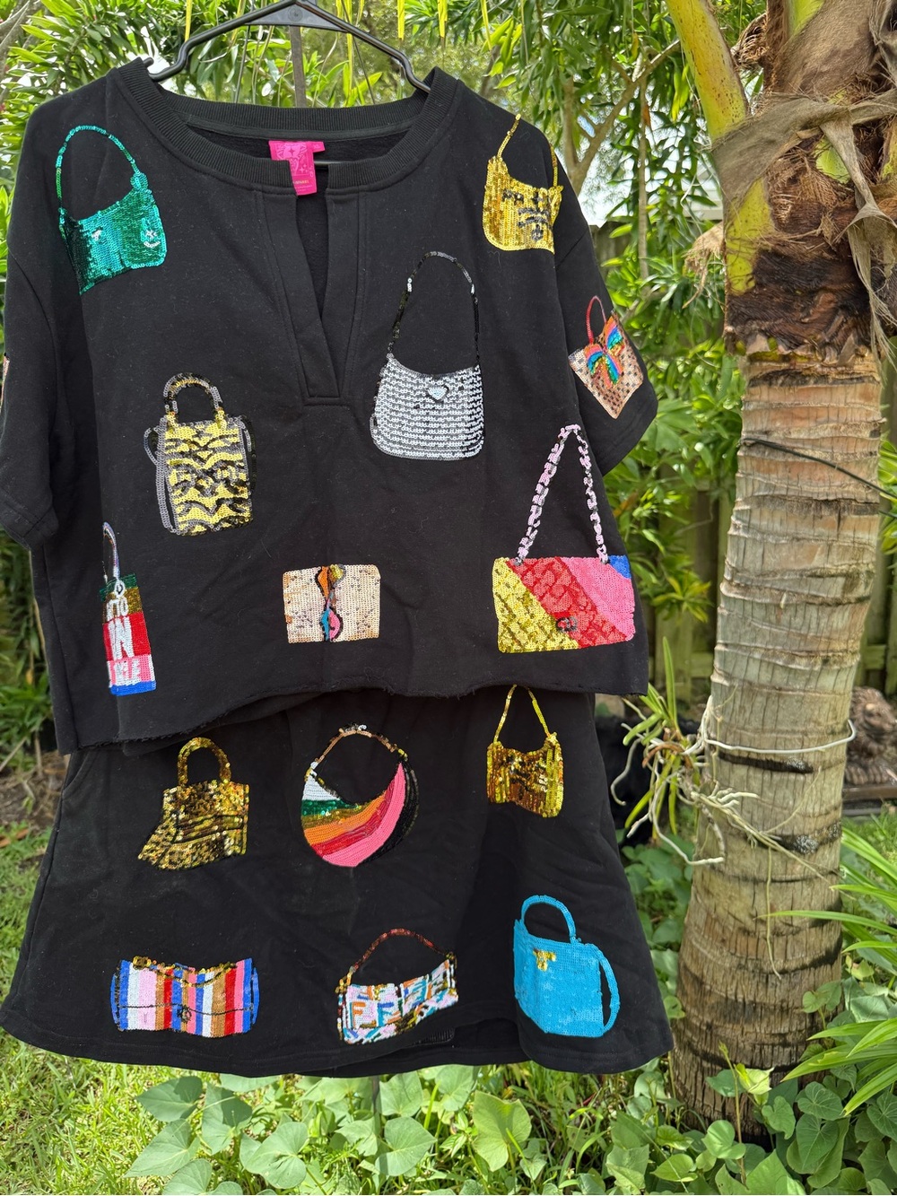 QUEEN OF SPARKLES Black Top and Skirt Set with Multicolor Sequin Handbag Motifs